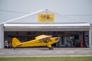 Taildraggers and flight instruction by Steve Krog of CubAir Flight at Hartford, WI airport. For instructor column in Sport Aviation. Erin Brueggen is student.